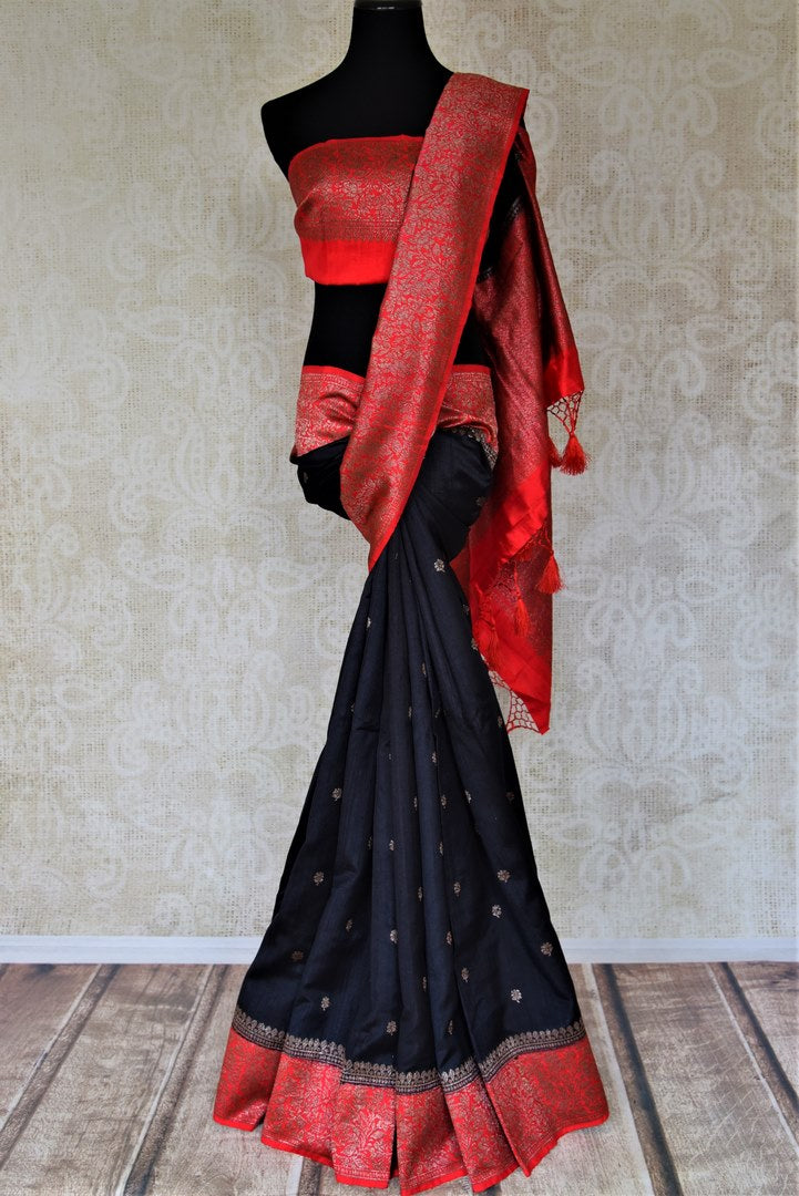 Buy black tussar Banarasi sari online in USA with zari buta and red zari border. Choose tasteful handloom saris for special occasions from Pure Elegance. Our exclusive Indian fashion store has a myriad of exquisite pure silk saris, tussar sarees, Banarasi sarees for Indian women in USA.-full view