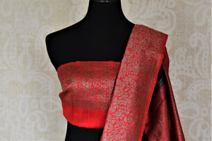Buy black tussar Banarasi sari online in USA with zari buta and red zari border. Choose tasteful handloom saris for special occasions from Pure Elegance. Our exclusive Indian fashion store has a myriad of exquisite pure silk saris, tussar sarees, Banarasi sarees for Indian women in USA.-blouse pallu