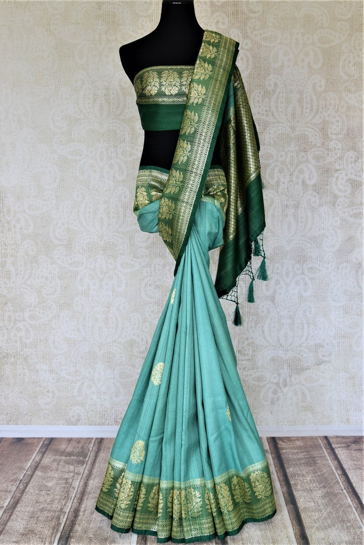 Buy beautiful sea green tussar Banarsi saree online in USA with floral zari buta border. Be the center of attraction at parties and weddings with beautiful Kanchipuram silk sarees, pure silk sarees, handwoven sarees, Banarasi sarees from Pure Elegance Indian fashion store in USA.-full view