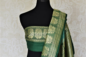 Buy beautiful sea green tussar Banarsi saree online in USA with floral zari buta border. Be the center of attraction at parties and weddings with beautiful Kanchipuram silk sarees, pure silk sarees, handwoven sarees, Banarasi sarees from Pure Elegance Indian fashion store in USA.-blouse pallu