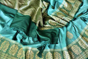 Buy beautiful sea green tussar Banarsi saree online in USA with floral zari buta border. Be the center of attraction at parties and weddings with beautiful Kanchipuram silk sarees, pure silk sarees, handwoven sarees, Banarasi sarees from Pure Elegance Indian fashion store in USA.-details