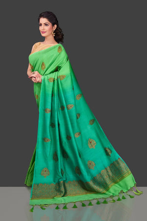 Shop alluring ombre green borderless muga Banarasi saree online in USA with antique zari buta. Shop beautiful Banarasi sarees, pure muga silk sarees in USA from Pure Elegance Indian fashion boutique in USA. Get spoiled for choices with a splendid variety of Indian saris to choose from! Shop now.-side