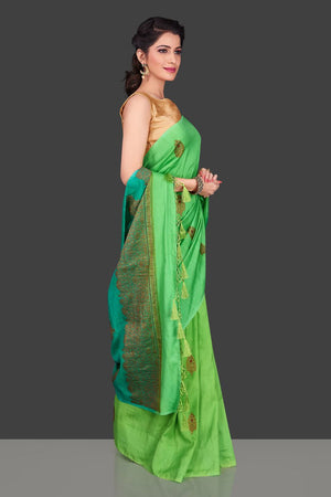 Shop alluring ombre green borderless muga Banarasi saree online in USA with antique zari buta. Shop beautiful Banarasi sarees, pure muga silk sarees in USA from Pure Elegance Indian fashion boutique in USA. Get spoiled for choices with a splendid variety of Indian saris to choose from! Shop now.-left 