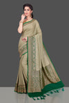 Shop stunning beige georgette Banarasi saree online in USA with green antique zari border. Shop beautiful Banarasi sarees, georgette sarees, pure muga silk sarees in USA from Pure Elegance Indian fashion boutique in USA. Get spoiled for choices with a splendid variety of Indian saris to choose from! Shop now.-full view