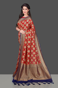 Buy bright red georgette Banarasi sari online in USA with blue zari border. Shop beautiful Banarasi sarees, georgette sarees, pure muga silk sarees in USA from Pure Elegance Indian fashion boutique in USA. Get spoiled for choices with a splendid variety of Indian saris to choose from! Shop now.-full view