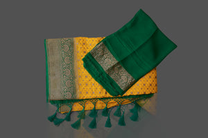 Buy beautiful yellow georgette Benarasi saree online in USA with green zari border. Shop beautiful Banarasi sarees, georgette sarees, pure muga silk sarees in USA from Pure Elegance Indian fashion boutique in USA. Get spoiled for choices with a splendid variety of Indian saris to choose from! Shop now.-details