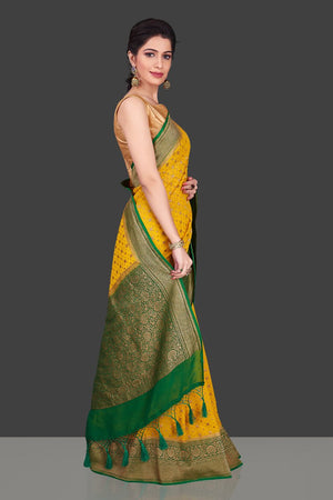 Buy beautiful yellow georgette Benarasi saree online in USA with green zari border. Shop beautiful Banarasi sarees, georgette sarees, pure muga silk sarees in USA from Pure Elegance Indian fashion boutique in USA. Get spoiled for choices with a splendid variety of Indian saris to choose from! Shop now.-side