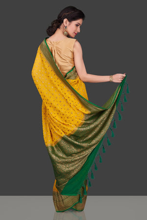 Buy beautiful yellow georgette Benarasi saree online in USA with green zari border. Shop beautiful Banarasi sarees, georgette sarees, pure muga silk sarees in USA from Pure Elegance Indian fashion boutique in USA. Get spoiled for choices with a splendid variety of Indian saris to choose from! Shop now.-back