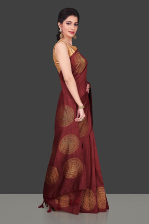 Buy elegant maroon borderless muga Benarasi saree online in USA with big antique zari buta. Shop beautiful Banarasi sarees, georgette sarees, pure muga silk sarees in USA from Pure Elegance Indian fashion boutique in USA. Get spoiled for choices with a splendid variety of Indian saris to choose from! Shop now.-side