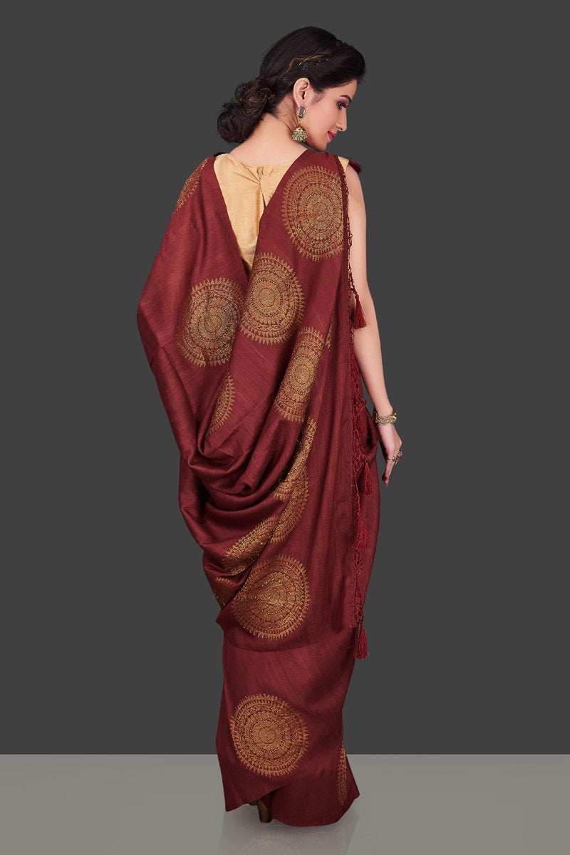 Buy elegant maroon borderless muga Benarasi saree online in USA with big antique zari buta. Shop beautiful Banarasi sarees, georgette sarees, pure muga silk sarees in USA from Pure Elegance Indian fashion boutique in USA. Get spoiled for choices with a splendid variety of Indian saris to choose from! Shop now.-back