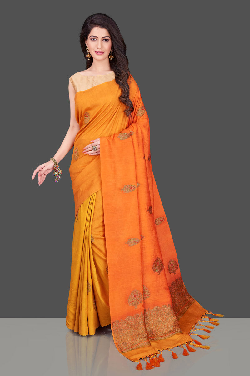 Buy charming orange and yellow borderless muga Benarasi sari online in USA with antique zari buta. Shop beautiful Banarasi sarees, georgette sarees, pure muga silk sarees in USA from Pure Elegance Indian fashion boutique in USA. Get spoiled for choices with a splendid variety of Indian saris to choose from! Shop now.-full view