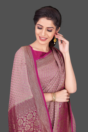 Buy gorgeous mauve color georgette Benarasi sari online in USA with magenta zari border. Shop beautiful Banarasi sarees, georgette sarees, pure muga silk sarees in USA from Pure Elegance Indian fashion boutique in USA. Get spoiled for choices with a splendid variety of Indian saris to choose from! Shop now.-closeup