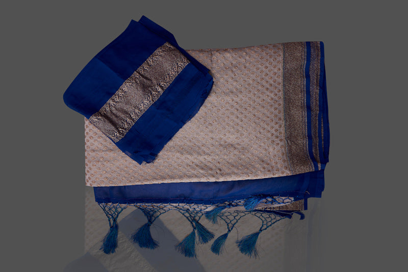 Buy light grey georgette Benarasi sari online in USA with blue zari border. Shop beautiful Banarasi sarees, georgette sarees, pure muga silk sarees in USA from Pure Elegance Indian fashion boutique in USA. Get spoiled for choices with a splendid variety of Indian saris to choose from! Shop now.-details