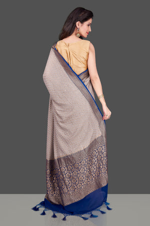 Buy light grey georgette Benarasi sari online in USA with blue zari border. Shop beautiful Banarasi sarees, georgette sarees, pure muga silk sarees in USA from Pure Elegance Indian fashion boutique in USA. Get spoiled for choices with a splendid variety of Indian saris to choose from! Shop now.-back