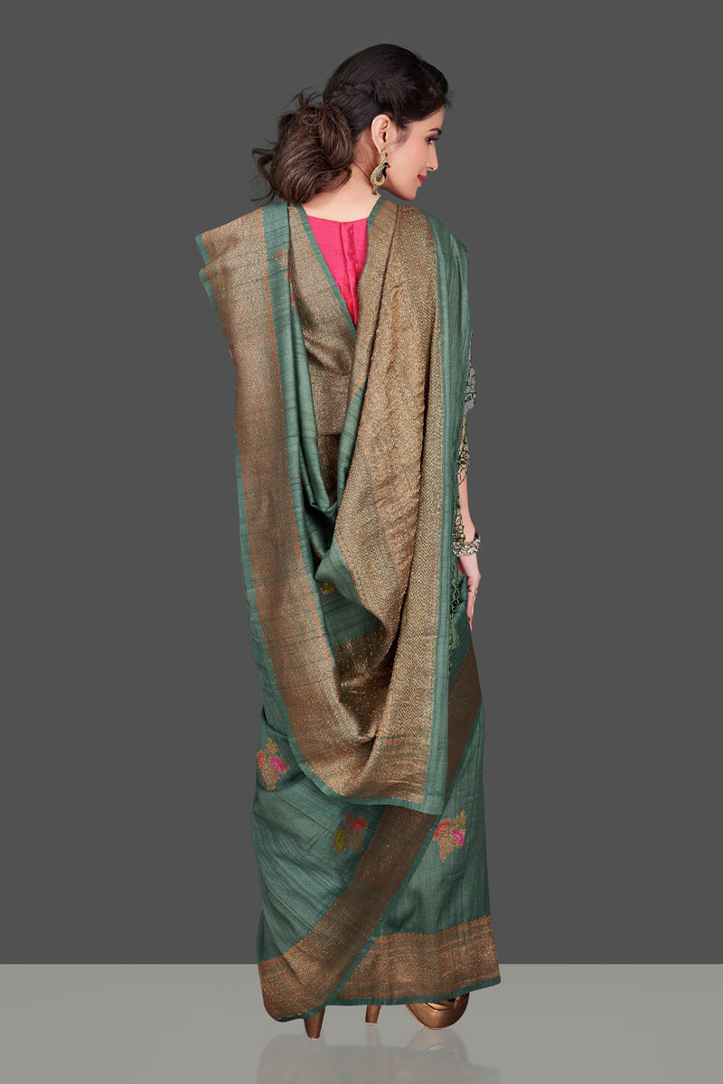Shop elegant green tussar Banarasi sari online in USA with antique zari minakari buta. Shop beautiful Banarasi sarees, tussar sarees, pure muga silk sarees in USA from Pure Elegance Indian fashion boutique in USA. Get spoiled for choices with a splendid variety of Indian saris to choose from! Shop now.-back