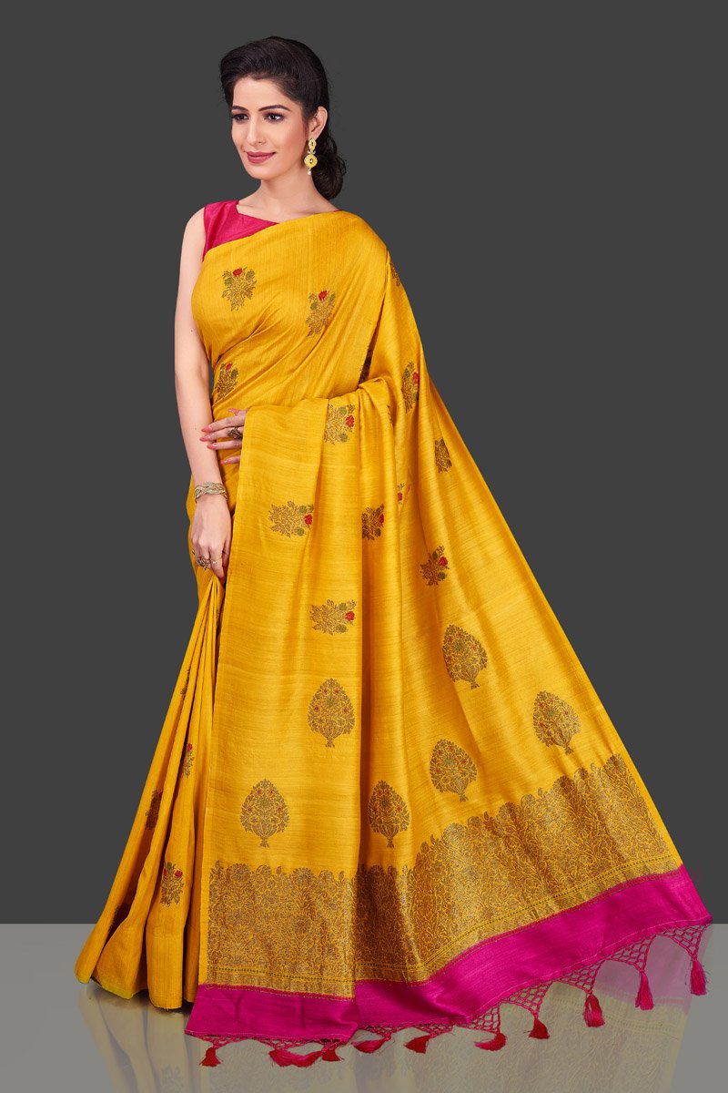 Buy gorgeous yellow borderless muga Banarasi saree online in USA with floral bunch zari buta. Shop beautiful Banarasi sarees, georgette sarees, pure muga silk sarees in USA from Pure Elegance Indian fashion boutique in USA. Get spoiled for choices with a splendid variety of Indian saris to choose from! Shop now.-full view