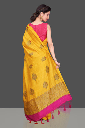 Buy gorgeous yellow borderless muga Banarasi saree online in USA with floral bunch zari buta. Shop beautiful Banarasi sarees, georgette sarees, pure muga silk sarees in USA from Pure Elegance Indian fashion boutique in USA. Get spoiled for choices with a splendid variety of Indian saris to choose from! Shop now.-back