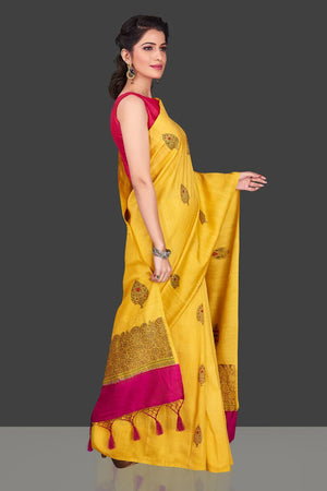 Buy bright yellow borderless muga Banarasi saree online in USA with zari buta. Shop beautiful Banarasi sarees, georgette sarees, pure muga silk sarees in USA from Pure Elegance Indian fashion boutique in USA. Get spoiled for choices with a splendid variety of Indian saris to choose from! Shop now.-side
