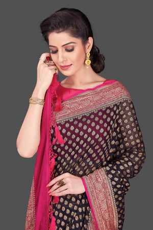 Shop beautiful black georgette Banarasi saree online in USA with pink zari border. Shop beautiful Banarasi sarees, georgette sarees, pure muga silk sarees in USA from Pure Elegance Indian fashion boutique in USA. Get spoiled for choices with a splendid variety of Indian saris to choose from! Shop now.-closeup