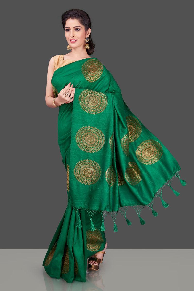 Buy bottle green borderless muga Banarasi sari online in USA with big antique zari buta. Shop beautiful Banarasi sarees, georgette sarees, pure muga silk sarees in USA from Pure Elegance Indian fashion boutique in USA. Get spoiled for choices with a splendid variety of Indian saris to choose from! Shop now.-front