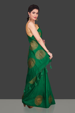 Buy bottle green borderless muga Banarasi sari online in USA with big antique zari buta. Shop beautiful Banarasi sarees, georgette sarees, pure muga silk sarees in USA from Pure Elegance Indian fashion boutique in USA. Get spoiled for choices with a splendid variety of Indian saris to choose from! Shop now.-side