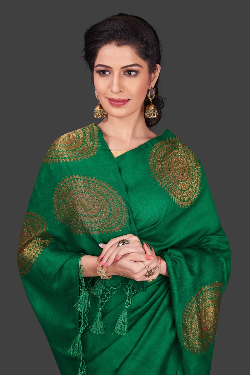 Buy bottle green borderless muga Banarasi sari online in USA with big antique zari buta. Shop beautiful Banarasi sarees, georgette sarees, pure muga silk sarees in USA from Pure Elegance Indian fashion boutique in USA. Get spoiled for choices with a splendid variety of Indian saris to choose from! Shop now.-closeup