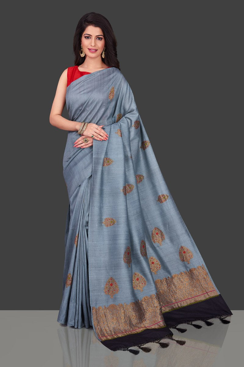 Buy light grey borderless muga Banarasi saree online in USA with floral zari buta. Shop beautiful Banarasi sarees, georgette sarees, pure muga silk sarees in USA from Pure Elegance Indian fashion boutique in USA. Get spoiled for choices with a splendid variety of designer saris to choose from! Shop now.-full view