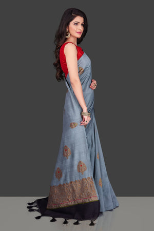Buy light grey borderless muga Banarasi saree online in USA with floral zari buta. Shop beautiful Banarasi sarees, georgette sarees, pure muga silk sarees in USA from Pure Elegance Indian fashion boutique in USA. Get spoiled for choices with a splendid variety of designer saris to choose from! Shop now.-rightside