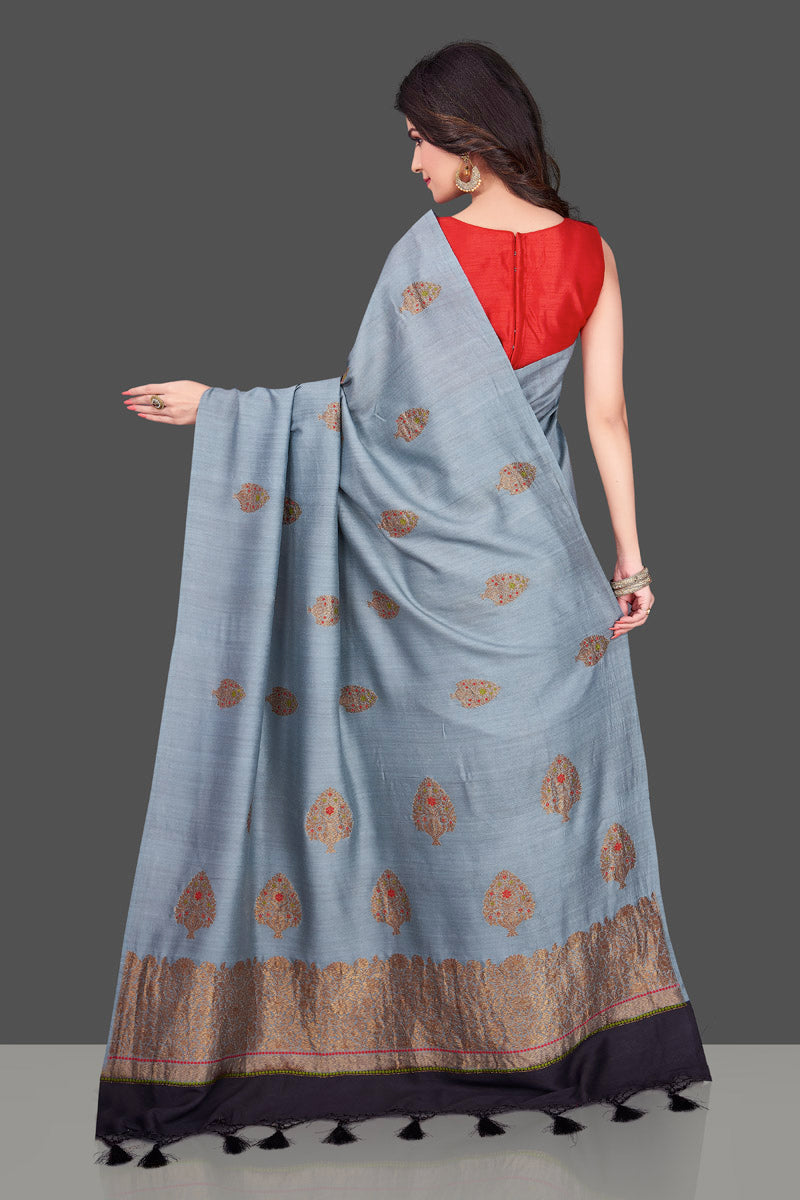 Buy light grey borderless muga Banarasi saree online in USA with floral zari buta. Shop beautiful Banarasi sarees, georgette sarees, pure muga silk sarees in USA from Pure Elegance Indian fashion boutique in USA. Get spoiled for choices with a splendid variety of designer saris to choose from! Shop now.-back