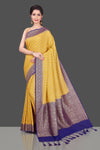 Buy online beautiful yellow georgette Benarasi saree in USA with blue zari border. Shop beautiful Banarasi sarees, georgette sarees, pure muga silk sarees in USA from Pure Elegance Indian fashion boutique in USA. Get spoiled for choices with a splendid variety of designer saris to choose from! Shop now.-full view