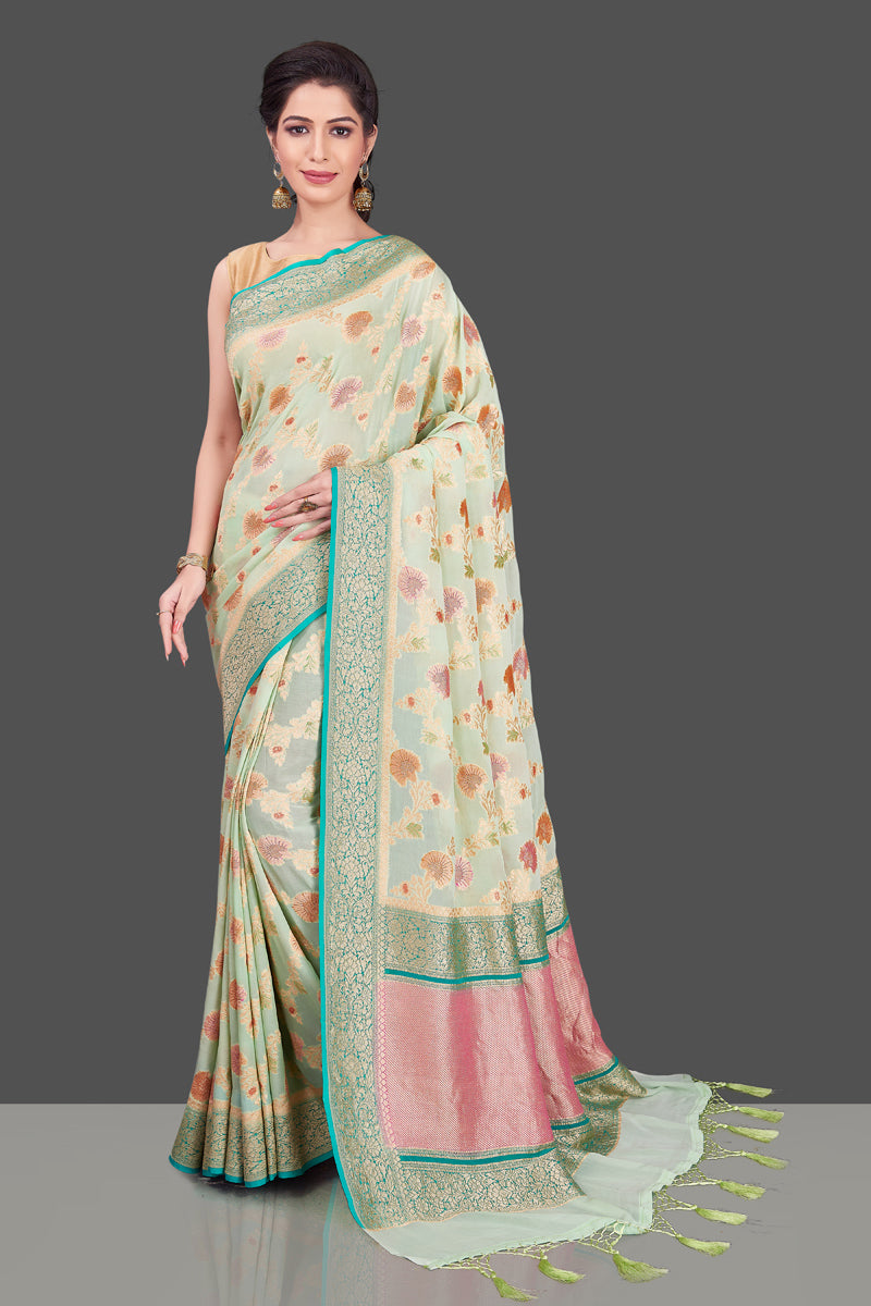 Buy mint green georgette Banarasi saree online in USA with floral zari jaal. Shop beautiful Banarasi georgette sarees, tussar sarees, pure muga silk sarees in USA from Pure Elegance Indian fashion boutique in USA. Get spoiled for choices with a splendid variety of Indian saris to choose from! Shop now.-full view