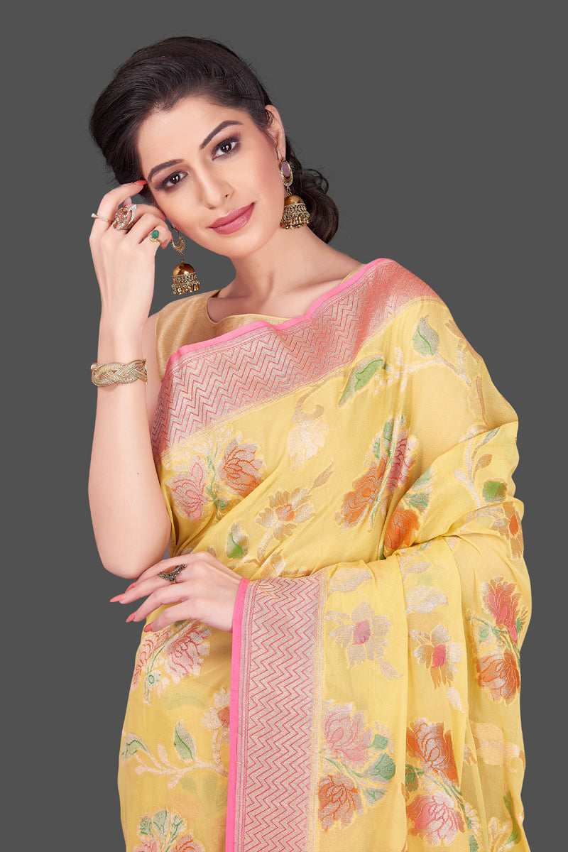 Buy stunning yellow georgette Banarasi sari online in USA with floral zari jaal. Shop beautiful Banarasi georgette sarees, tussar sarees, pure muga silk sarees in USA from Pure Elegance Indian fashion boutique in USA. Get spoiled for choices with a splendid variety of Indian saris to choose from! Shop now.-closeup
