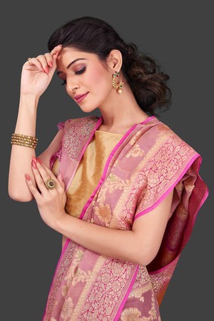 Buy gorgeous dusty pink georgette Benarasi sari online in USA with floral zari jaal. Shop beautiful Banarasi georgette sarees, tussar sarees, pure muga silk sarees in USA from Pure Elegance Indian fashion boutique in USA. Get spoiled for choices with a splendid variety of Indian saris to choose from! Shop now.-closeup