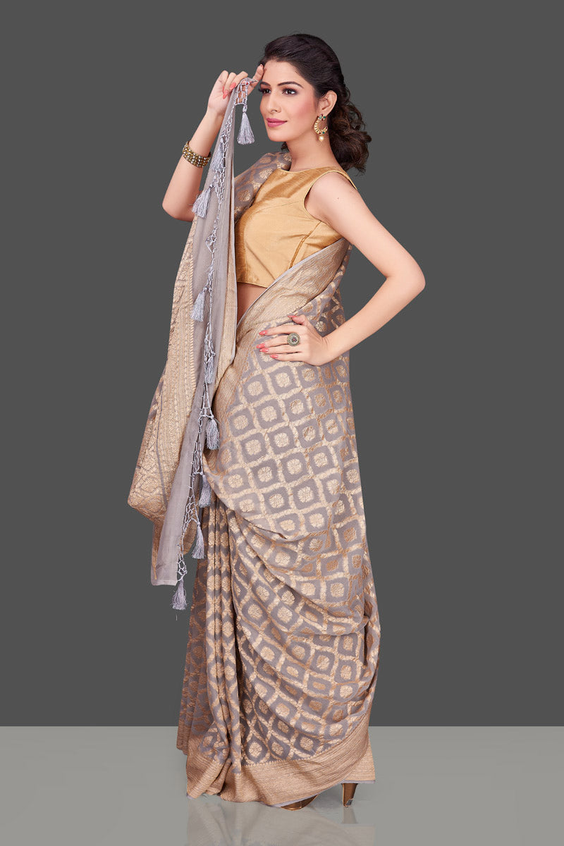 Shop beautiful light grey Banarasi georgette sari online in USA with zari work. Shop beautiful Banarasi georgette sarees, tussar saris, pure muga silk saris in USA from Pure Elegance Indian fashion boutique in USA. Get spoiled for choices with a splendid variety of Indian sarees to choose from! Shop now.-full view