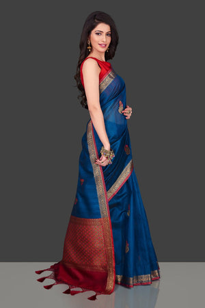 Shop dark blue Banarasi tassar saree in USA with floral zari buta. Shop beautiful Banarasi georgette sarees, tussar saris, pure muga silk saris in USA from Pure Elegance Indian fashion boutique in USA. Get spoiled for choices with a splendid variety of Indian sarees to choose from! Shop now.-side
