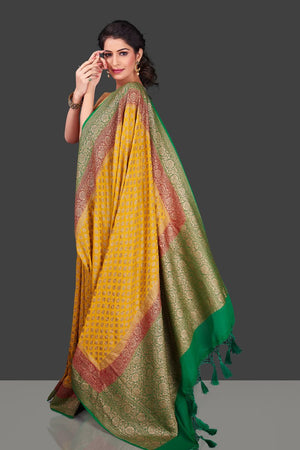 Buy online attractive yellow georgette Benarasi sari in USA with pink green zari border. Shop beautiful Banarasi georgette sarees, tussar saris, pure muga silk saris in USA from Pure Elegance Indian fashion boutique in USA. Get spoiled for choices with a splendid variety of Indian sarees to choose from! Shop now.-side