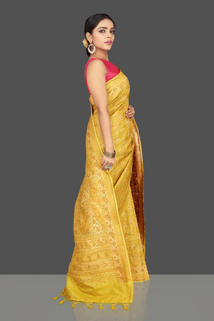Buy stunning yellow tanchui Banarasi sari online in USA. Be the center of attraction at weddings and parties with your captivating ethnic style in beautiful Banarsi silk saris. tanchoi sarees from Pure Elegance Indian fashion store in USA.-right side