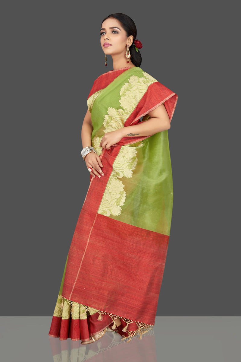 Buy green organza Banarasi saree online in USA with zari work on red border. Be the center of attraction at weddings and parties with your captivating ethnic style in beautiful Banarsi silk saris. tanchoi sarees from Pure Elegance Indian fashion store in USA.-side