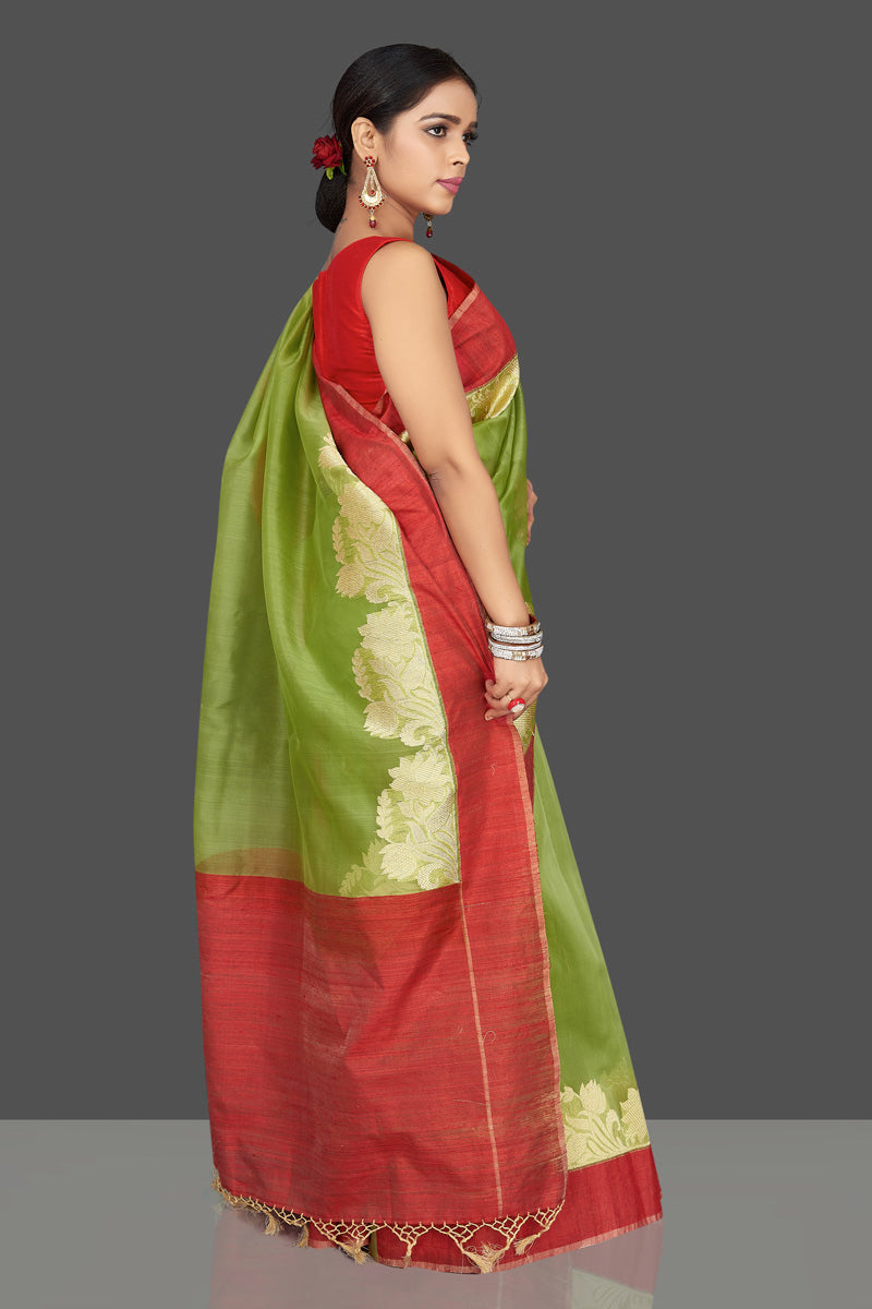 Buy green organza Banarasi saree online in USA with zari work on red border. Be the center of attraction at weddings and parties with your captivating ethnic style in beautiful Banarsi silk saris. tanchoi sarees from Pure Elegance Indian fashion store in USA.-back