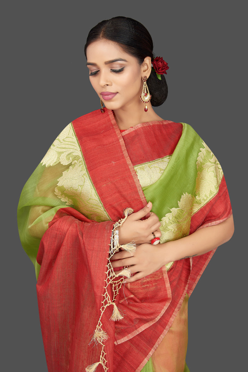 Buy green organza Banarasi saree online in USA with zari work on red border. Be the center of attraction at weddings and parties with your captivating ethnic style in beautiful Banarsi silk saris. tanchoi sarees from Pure Elegance Indian fashion store in USA.-closeup