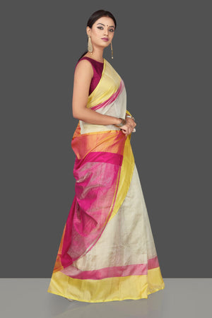 Buy beautiful off-white  Uppada silk saree online in USA with pink and yellow border. Keep it elegant with handwoven silk sarees, Uppada silk sarees from Pure Elegance Indian fashion boutique in USA.-right