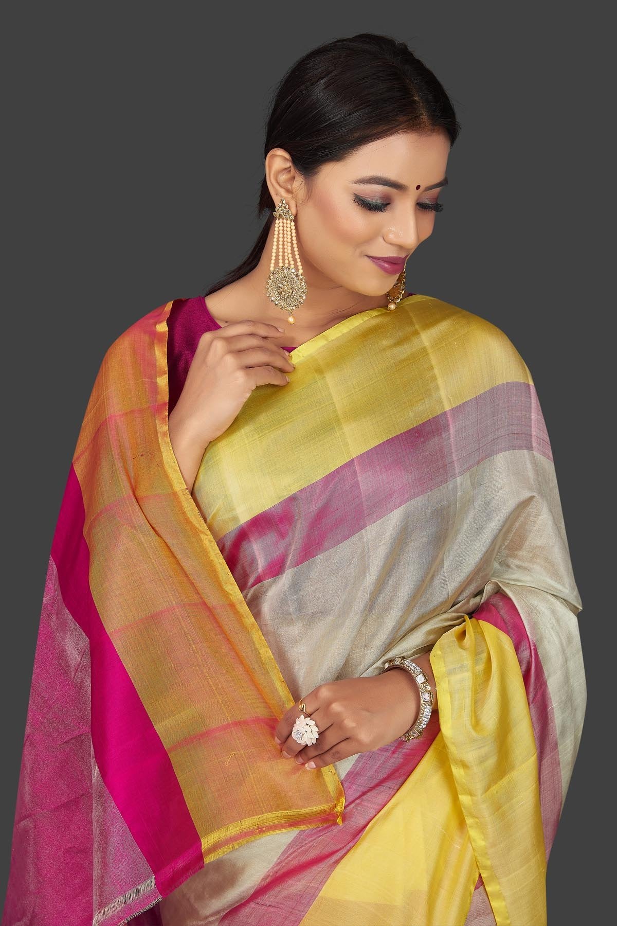 Buy beautiful off-white  Uppada silk saree online in USA with pink and yellow border. Keep it elegant with handwoven silk sarees, Uppada silk sarees from Pure Elegance Indian fashion boutique in USA.-closeup
