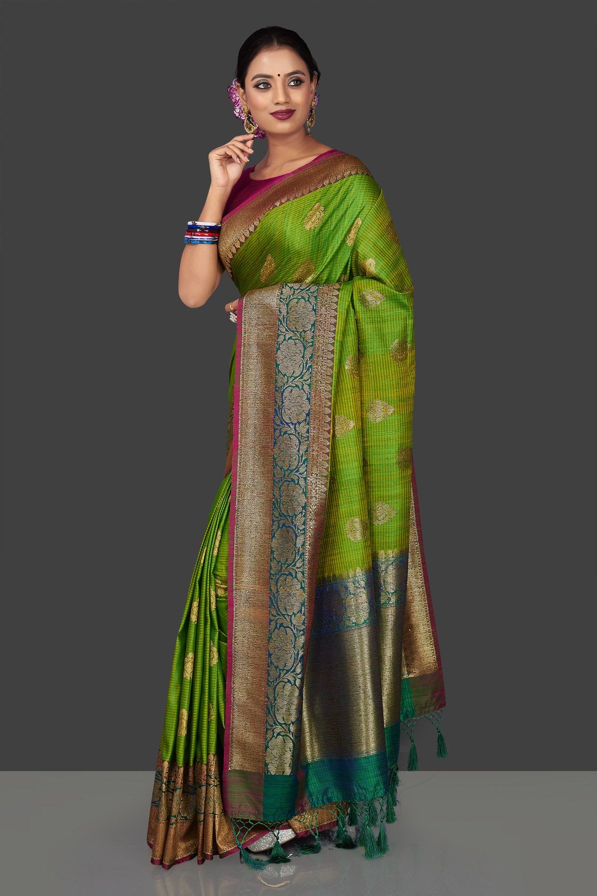 Buy light green tassar Banarasi saree online in USA with antique zari sea green border and zari buta. Garner compliments on weddings and special occasions with exquisite Banarasi saris, handwoven silk sarees, tussar sarees from Pure Elegance Indian fashion store in USA.-side