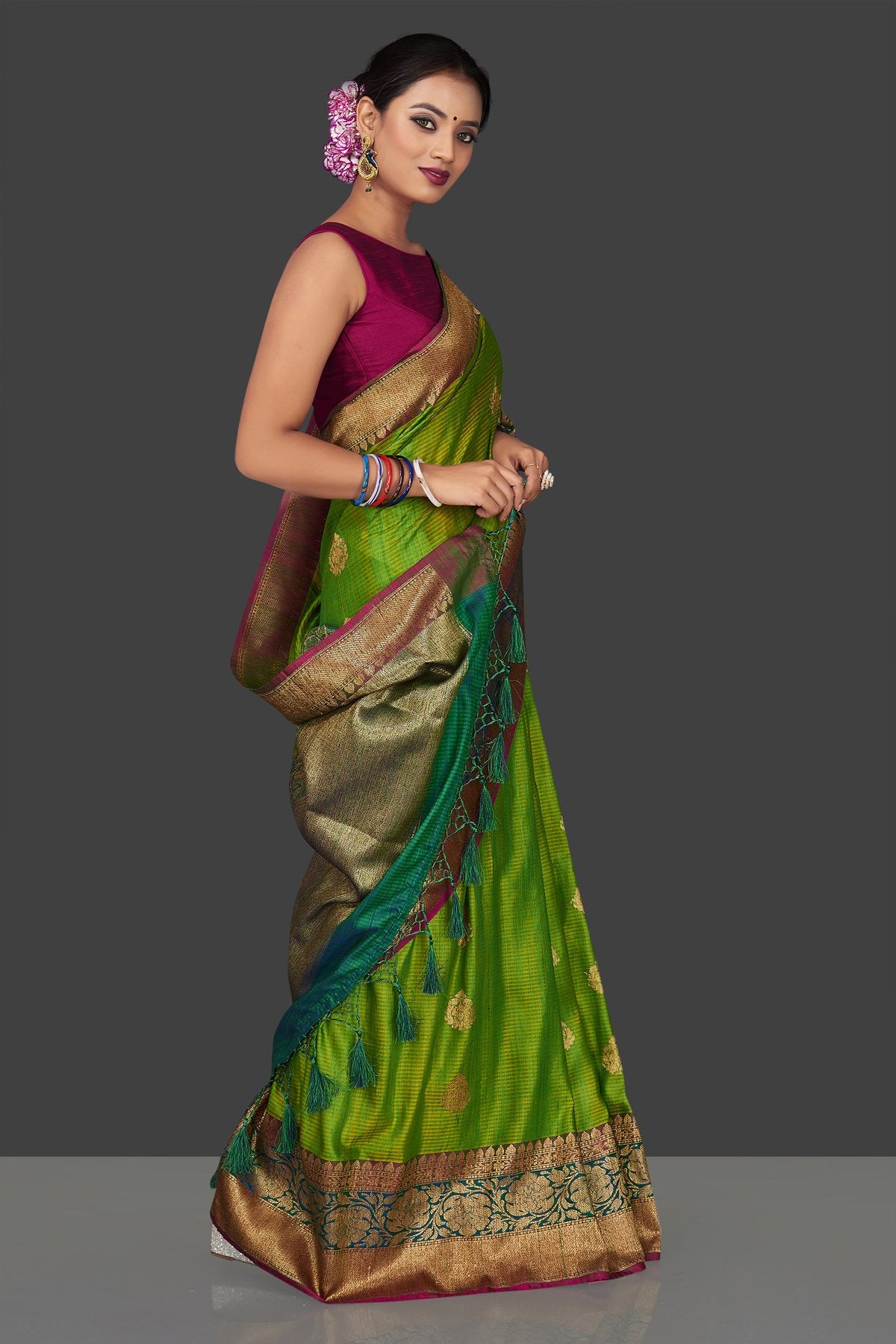 Buy light green tassar Banarasi saree online in USA with antique zari sea green border and zari buta. Garner compliments on weddings and special occasions with exquisite Banarasi saris, handwoven silk sarees, tussar sarees from Pure Elegance Indian fashion store in USA.-