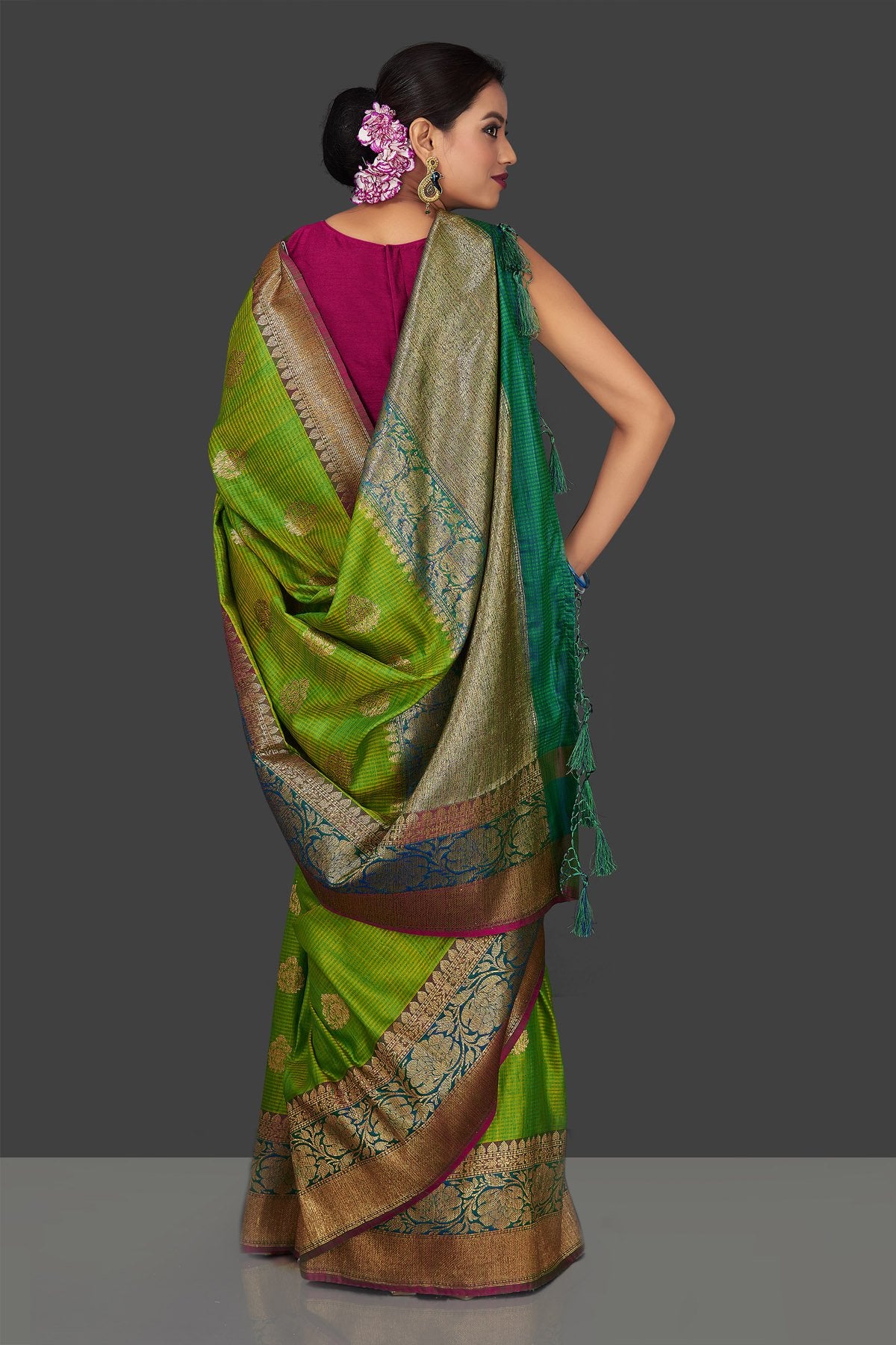 Buy light green tassar Banarasi saree online in USA with antique zari sea green border and zari buta. Garner compliments on weddings and special occasions with exquisite Banarasi saris, handwoven silk sarees, tussar sarees from Pure Elegance Indian fashion store in USA.-back