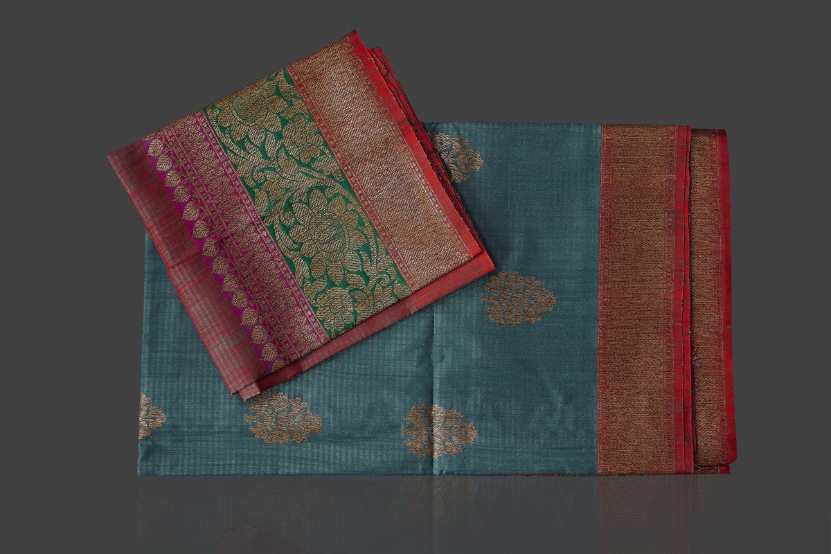 Buy gorgeous steel blue tassar Banarasi saree online in USA with antique zari border and zari buta. Garner compliments on weddings and special occasions with exquisite Banarasi sarees, handwoven silk sarees, tussar sarees from Pure Elegance Indian fashion store in USA.-blouse