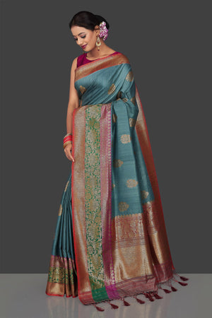 Buy gorgeous steel blue tassar Banarasi saree online in USA with antique zari border and zari buta. Garner compliments on weddings and special occasions with exquisite Banarasi sarees, handwoven silk sarees, tussar sarees from Pure Elegance Indian fashion store in USA.-side