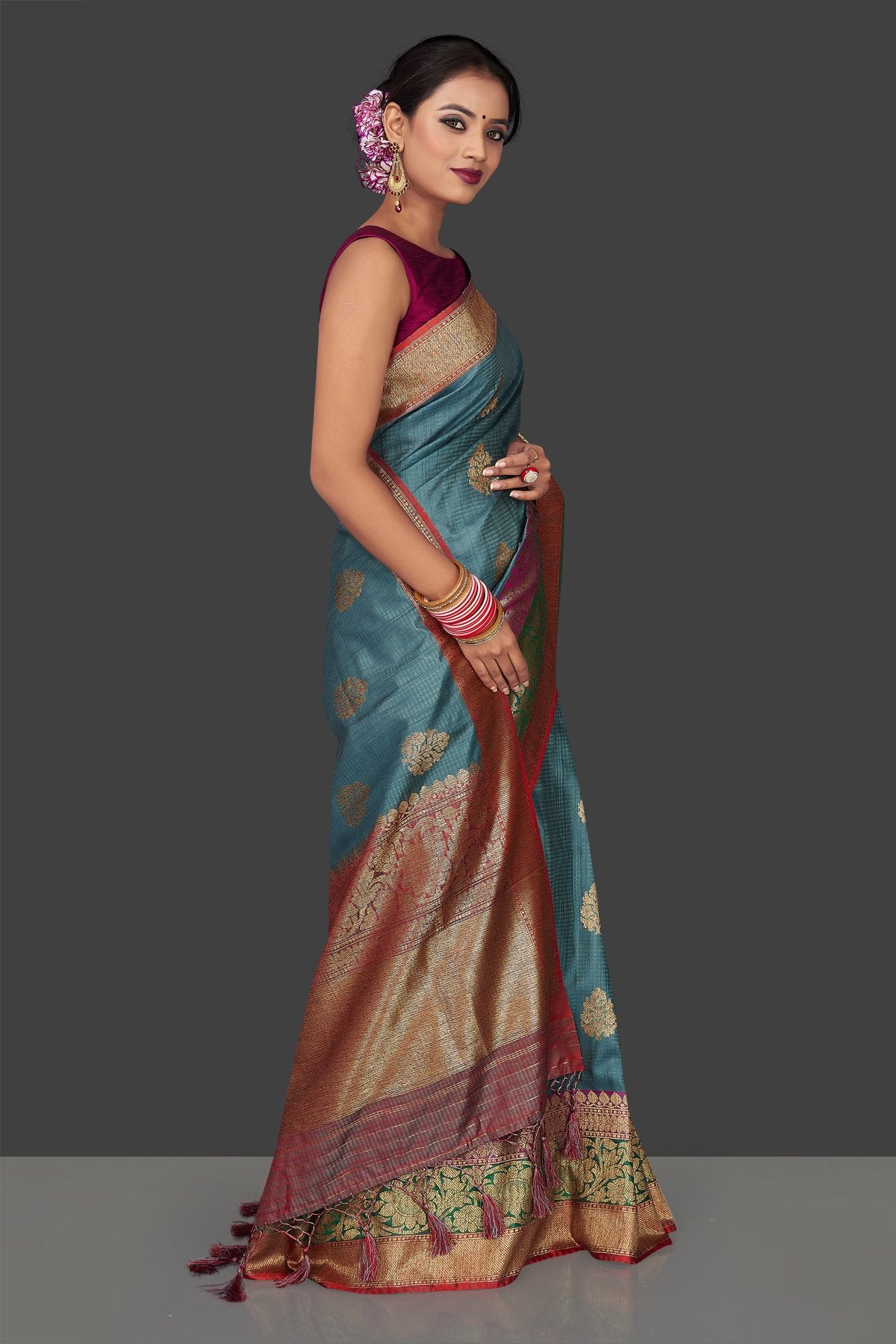 Buy gorgeous steel blue tassar Banarasi saree online in USA with antique zari border and zari buta. Garner compliments on weddings and special occasions with exquisite Banarasi sarees, handwoven silk sarees, tussar sarees from Pure Elegance Indian fashion store in USA.-right
