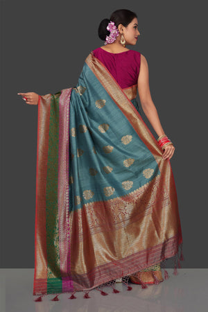 Buy gorgeous steel blue tassar Banarasi saree online in USA with antique zari border and zari buta. Garner compliments on weddings and special occasions with exquisite Banarasi sarees, handwoven silk sarees, tussar sarees from Pure Elegance Indian fashion store in USA.-back