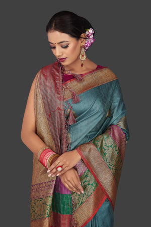 Buy gorgeous steel blue tassar Banarasi saree online in USA with antique zari border and zari buta. Garner compliments on weddings and special occasions with exquisite Banarasi sarees, handwoven silk sarees, tussar sarees from Pure Elegance Indian fashion store in USA.-closeup